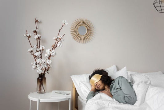 Woman resting comfortably while wearing a sleep mask